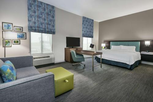 a hotel room with a bed and a desk at Hampton Inn & Suites By Hilton-Corpus Christi Portland,Tx in Portland