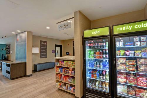 a store with two refrigerators in a store at Home2 Suites Pensacola I-10 At North Davis Hwy in Pensacola