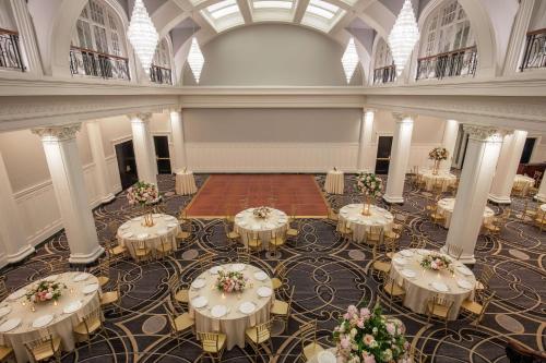 a large banquet hall with tables in a building at The Virginian Lynchburg, Curio Collection By Hilton in Lynchburg