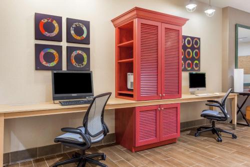 an office with a desk with a computer and two chairs at Home2 Suites by Hilton Albany Airport/Wolf Rd in Albany