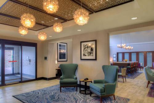a waiting room with chairs and a table at Hampton Inn & Suites Wixom/Novi/Detroit, Mi in Wixom