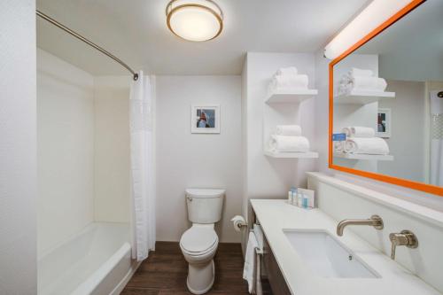 a bathroom with a toilet and a sink and a tub at Hampton Inn & Suites Wixom/Novi/Detroit, Mi in Wixom