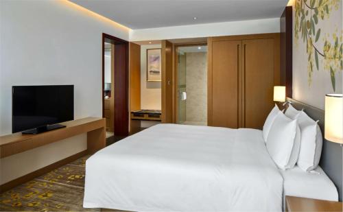 Letto o letti in una camera di Hilton Garden Inn Foshan