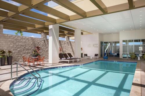 a swimming pool in the middle of a house at Hampton Inn & Suites Oahu/Kapolei, HI - FREE Breakfast in Kapolei