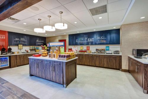 a fast food restaurant with wooden cabinets and counters at Hampton Inn & Suites Wells, Nv in Wells
