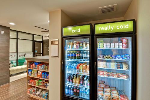 a refrigerator in a store with lots of drinks at Home2 Suites By Hilton Stafford Quantico in Stafford