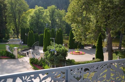 a view of a park with trees and bushes at FloraVilla in Rajecké Teplice