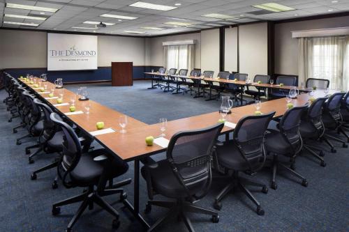 a large conference room with a long table and chairs at The Desmond Hotel Malvern, a DoubleTree by Hilton in Malvern