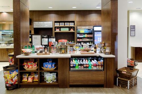 a counter in a store with food and drinks at Hilton Garden Inn Salina in Salina