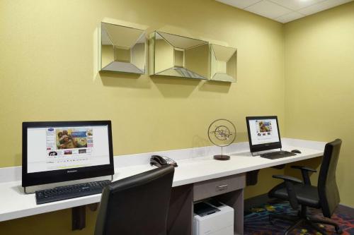 an office with two computers sitting on a desk at Hampton Inn & Suites St. Louis/Alton, IL in Alton