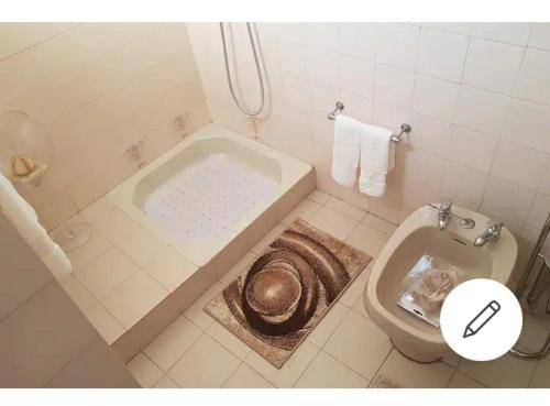 a bathroom with a bath tub and a toilet at Cacho D'ouro in Santa Marta de Penaguião