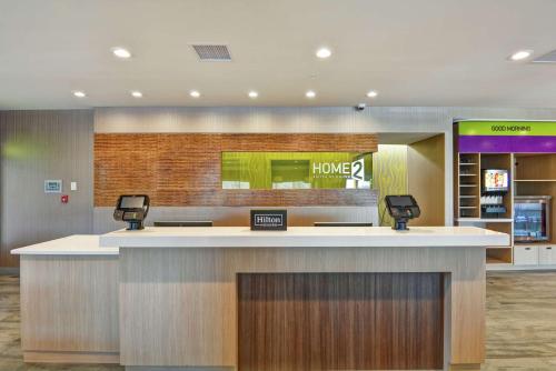 a lobby with a home counter in a hospital at Home2 Suites By Hilton Dayton Vandalia in Dayton