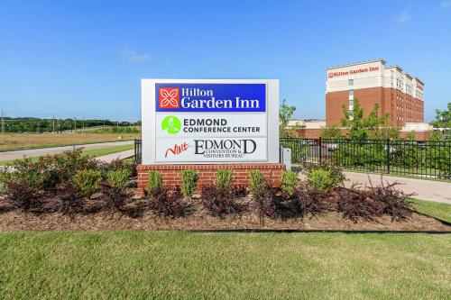 a sign for a garden firm in front of a building at Hilton Garden Inn Edmond/Oklahoma City North in Edmond