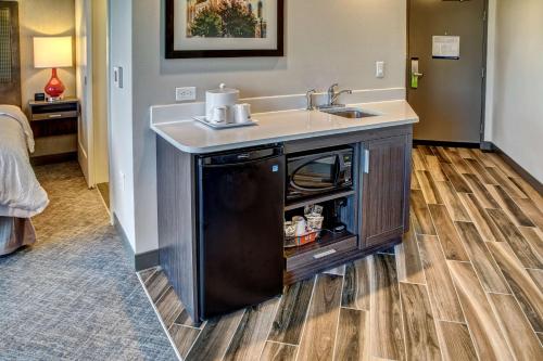a kitchen with a sink and a counter top at Hampton Inn & Suites Franklin Berry Farms, Tn in Franklin