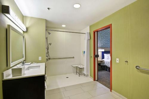 a bathroom with a sink and a shower at Home2 Suites by Hilton Brownsville in Brownsville