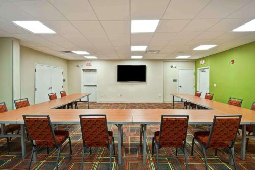 a large conference room with a large table and chairs at Home2 Suites by Hilton Atlanta Norcross in Norcross