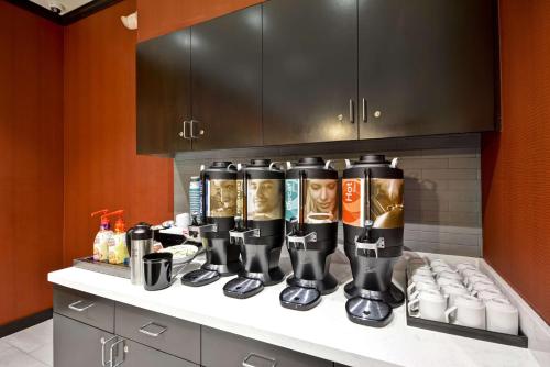 a counter with a bunch of drinks on it at Homewood Suites By Hilton Rocky Mount in Rocky Mount