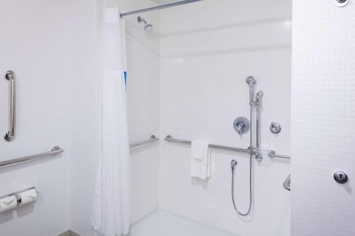 a bathroom with a shower with a shower curtain at Hampton Inn & Suites Chicago-Burr Ridge in Burr Ridge