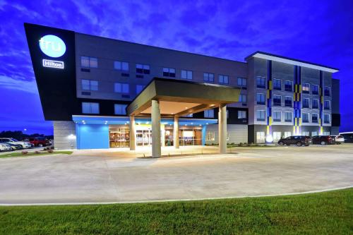 a building with a parking lot in front of it at Tru By Hilton North Platte in North Platte