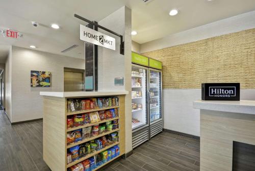 a home store with a sign that reads home supermarket at Home2 Suites By Hilton Texas City Houston in Texas City