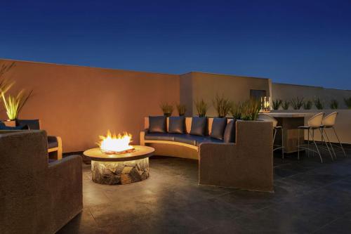 a living room with a couch and a table at Homewood Suites By Hilton Monterrey Apodaca in Monterrey