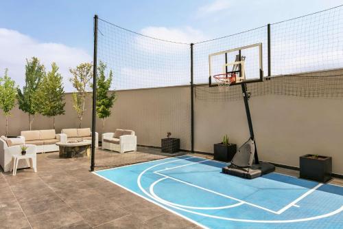 a basketball court with a hoop on a patio at Homewood Suites By Hilton Monterrey Apodaca in Monterrey