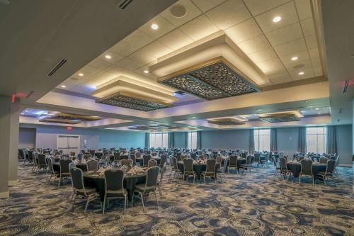 a banquet hall with tables and chairs in a room at Hilton Garden Inn Madison Sun Prairie in Sun Prairie