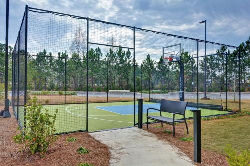 a basketball hoop with a chair on a tennis court at Homewood Suites By Hilton Savannah Airport in Savannah