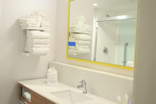 a bathroom with a sink and a mirror and towels at Hampton Inn & Suites Mount Laurel/Moorestown in Mount Laurel
