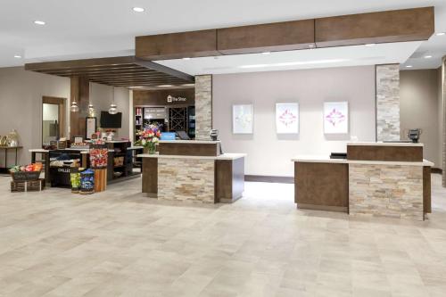a lobby of a store with a reception desk at Hilton Garden Inn Waco in Waco