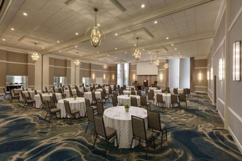 a banquet hall with tables and chairs in a room at Hotel Ballast Wilmington, Tapestry Collection by Hilton in Wilmington