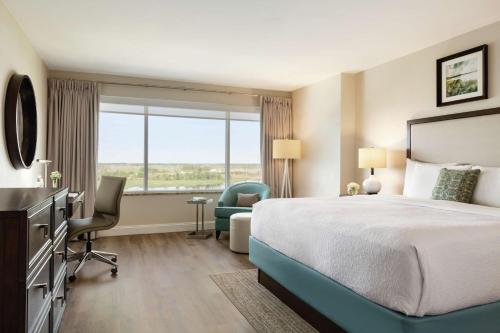 a hotel room with a bed and a window at Hotel Ballast Wilmington, Tapestry Collection by Hilton in Wilmington