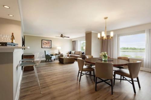 a dining room and living room with a table and chairs at Hotel Ballast Wilmington, Tapestry Collection by Hilton in Wilmington