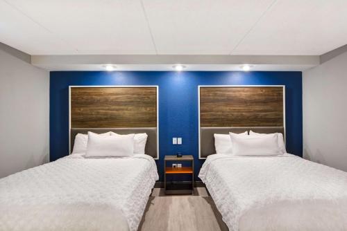 Ένα ή περισσότερα κρεβάτια σε δωμάτιο στο Tru by Hilton Syracuse North Airport Area