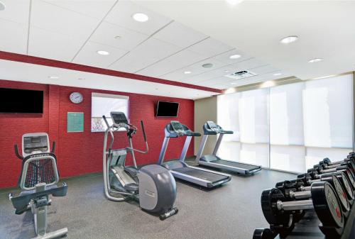 a gym with treadmills and cardio equipment in a room at Home2 Suites By Hilton Richmond Hill Savannah I-95 in Richmond Hill