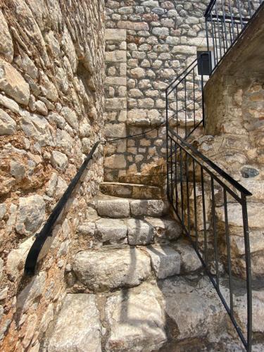 a stone staircase in a stone wall at Terra Petra Mani in Koíta