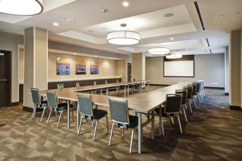 a large conference room with a long table and chairs at Home2 Suites by Hilton Los Angeles Montebello in Montebello