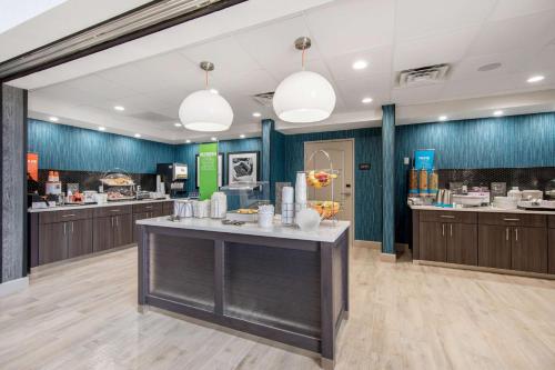 a large kitchen with a large island in a restaurant at Hampton Inn & Suites Ruidoso Downs in Ruidoso Downs