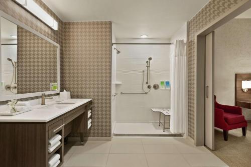 a bathroom with a sink and a shower and a tub at Home2 Suites By Hilton San Antonio North Stone Oak in San Antonio