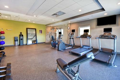 a gym with treadmills and cardio equipment in a room at Home 2 Suites By Hilton Dothan in Dothan
