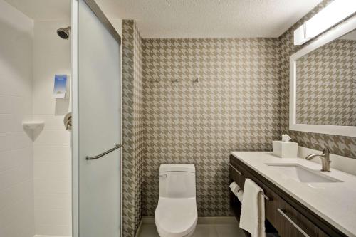 a bathroom with a toilet and a sink at Home2 Suites By Hilton Portland Airport in South Portland