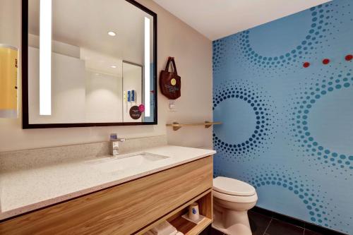 a bathroom with a sink and a toilet at Tru By Hilton Edmonton Windermere in Edmonton