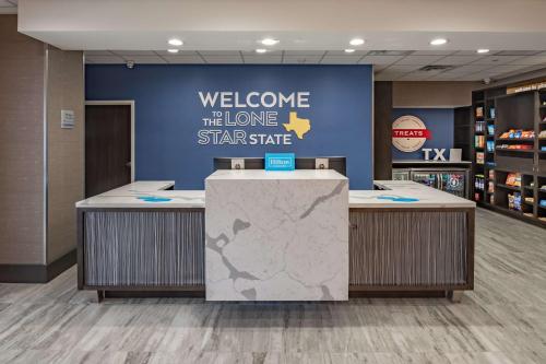 a welcome to the lone star state sign in a store at Hampton Inn & Suites Dallas/Plano Central in Plano