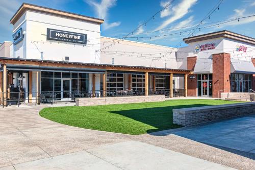 a building with a lawn in front of it at Home2 Suites By Hilton Nashville Bellevue in Bellevue