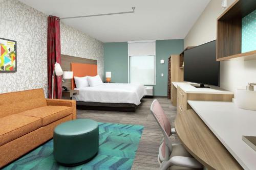 Ένα ή περισσότερα κρεβάτια σε δωμάτιο στο Home2 Suites by Hilton Lakeland South Polk Parkway