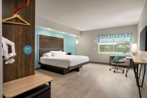 מיטה או מיטות בחדר ב-Tru By Hilton Florence I-95