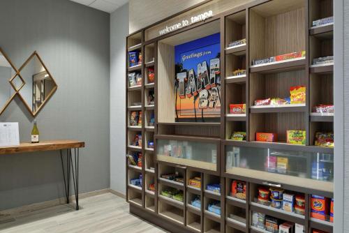 a room with shelves with food items on them at Hampton Inn Tampa Downtown Channel District in Tampa