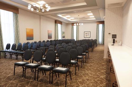 a room with rows of chairs in a hall at Hilton Garden Inn Elizabethtown in Elizabethtown