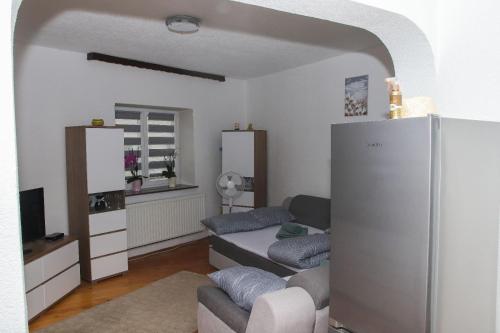 Ένα ή περισσότερα κρεβάτια σε δωμάτιο στο Ema Apartman