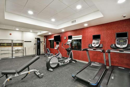 a gym with cardio equipment in a room at Home2 Suites By Hilton Warner Robins in Warner Robins